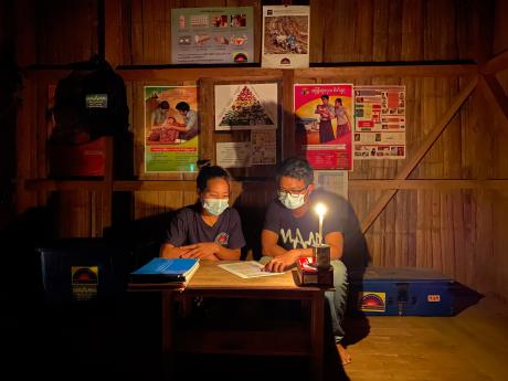 A medical consultation by candlelight